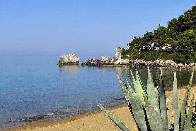 Corfu: A relaxed day at Glyfada Beach - Beach-club comfort at Glyfada: loungers, umbrella, and water time