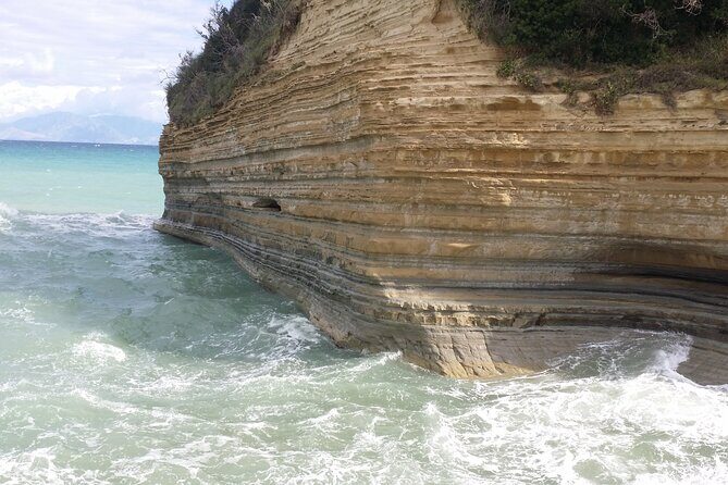 Corfu beach private tour to Porto Timoni, Canal d' Amour and San Stefanos - Agios Stefanos Beach: long sand, calm water, and lunch on cue