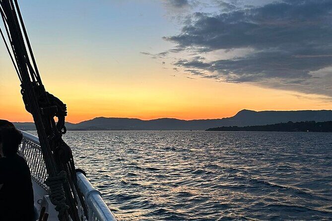 Corfu: Sunset Cruise on a Wooden Vessel with Cocktails & Bites - A wooden boat, a true photo hour, and Corfu by coastline