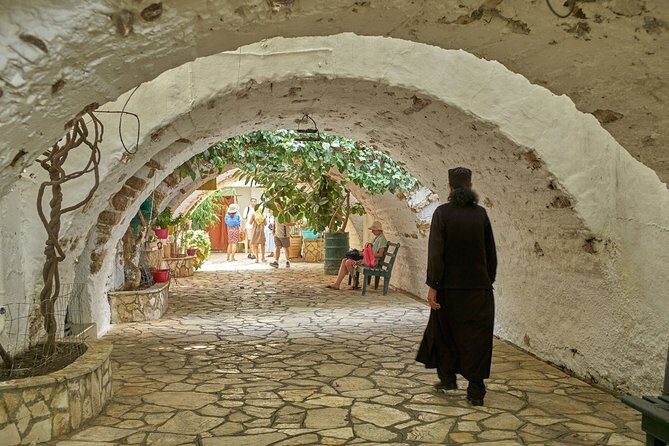 Private tour to Palaiokastritsa beach and Lakwnes village - Entering Palaiokastritsa: Blue Caves area and monastery views